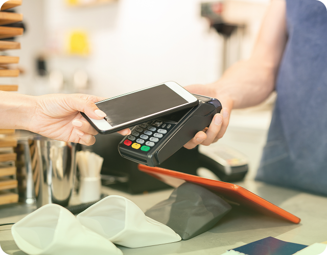Customer making a payment using a POS terminal